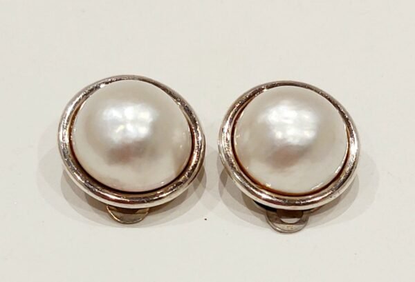 Mabe pearl clip on earrings set in silver