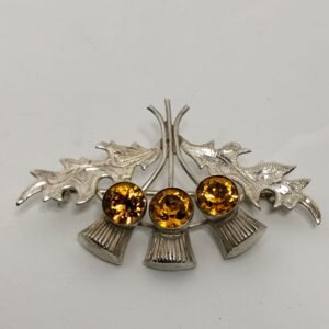 Sterling silver brooch with orange paste