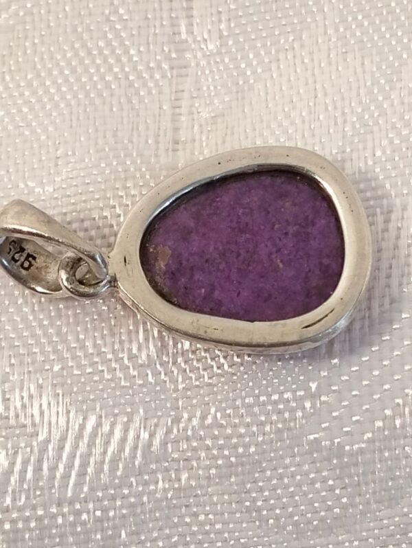 Sterling silver pendant with purple stone